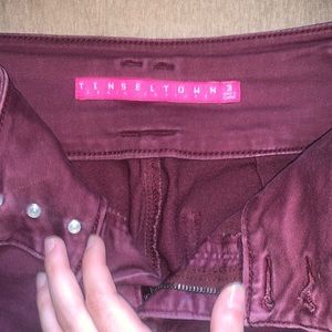 Dark maroon or purple skinny jeans